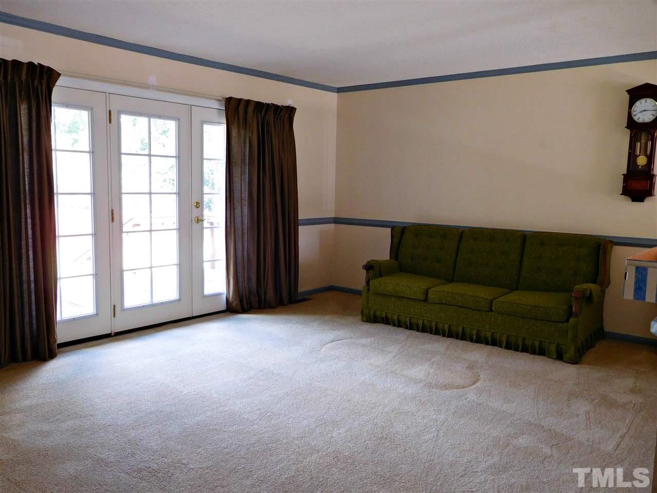 2217 Timberlake Drive Raleigh, NC 27604 - Photo 8 of 22 a living room with furniture and a window
