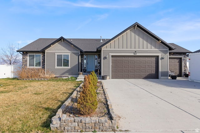 463 South Trejo Ridge Road Grantsville, UT 84029 - Photo 1 of 22 Ranch-style exterior with gray siding, stone accents, and a light blue entry door