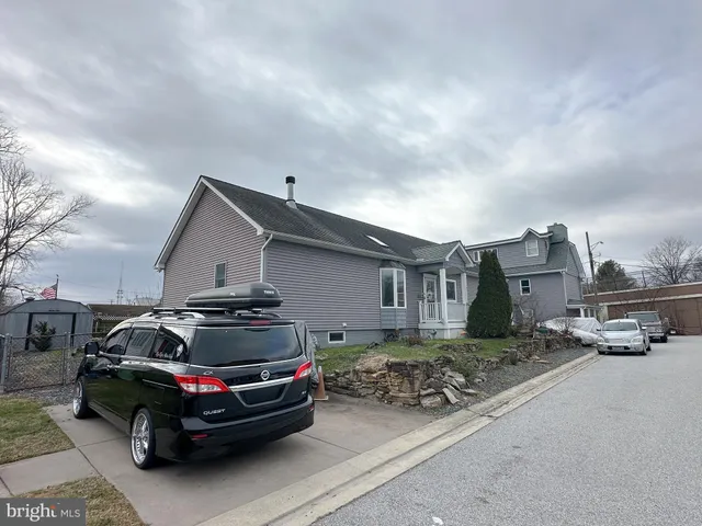 a car parked in front of a house
