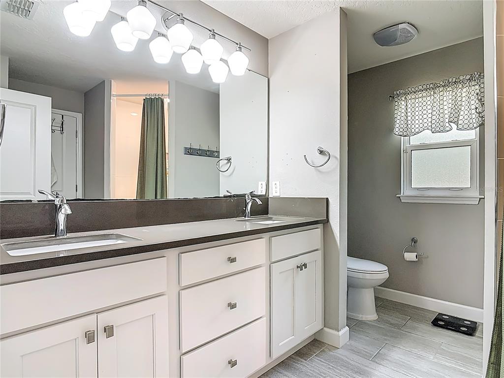 108 Palmira Road DeBary, FL 32713 - Photo 16 of 29 a bathroom with a double vanity sink and a toilet
