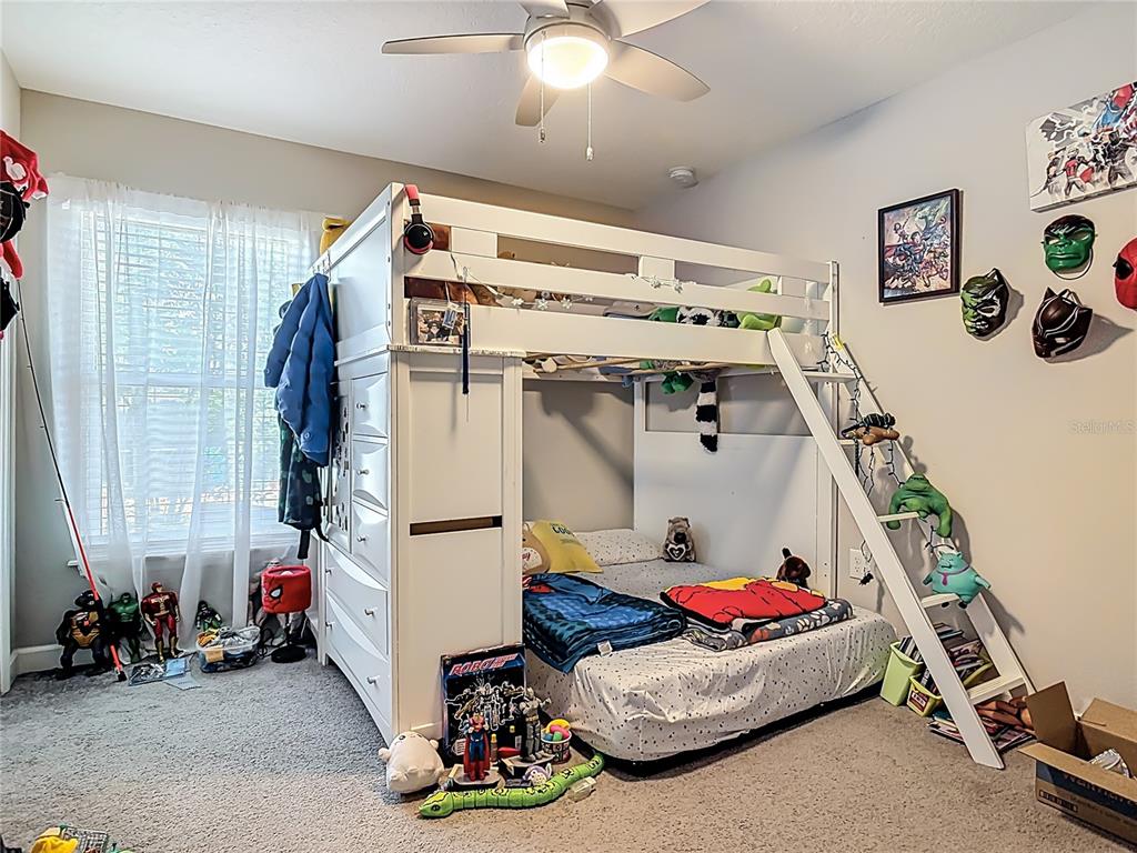 108 Palmira Road DeBary, FL 32713 - Photo 18 of 29 a room with gym equipment and a chandelier