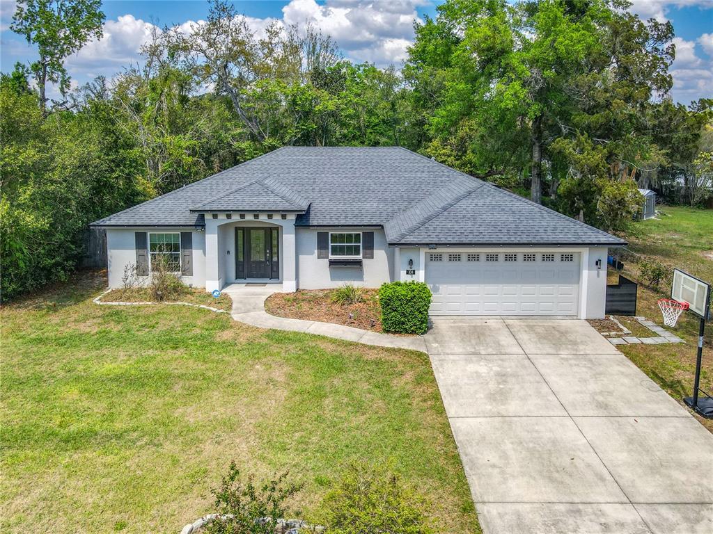 108 Palmira Road DeBary, FL 32713 - Photo 2 of 29 a house view with a garden space