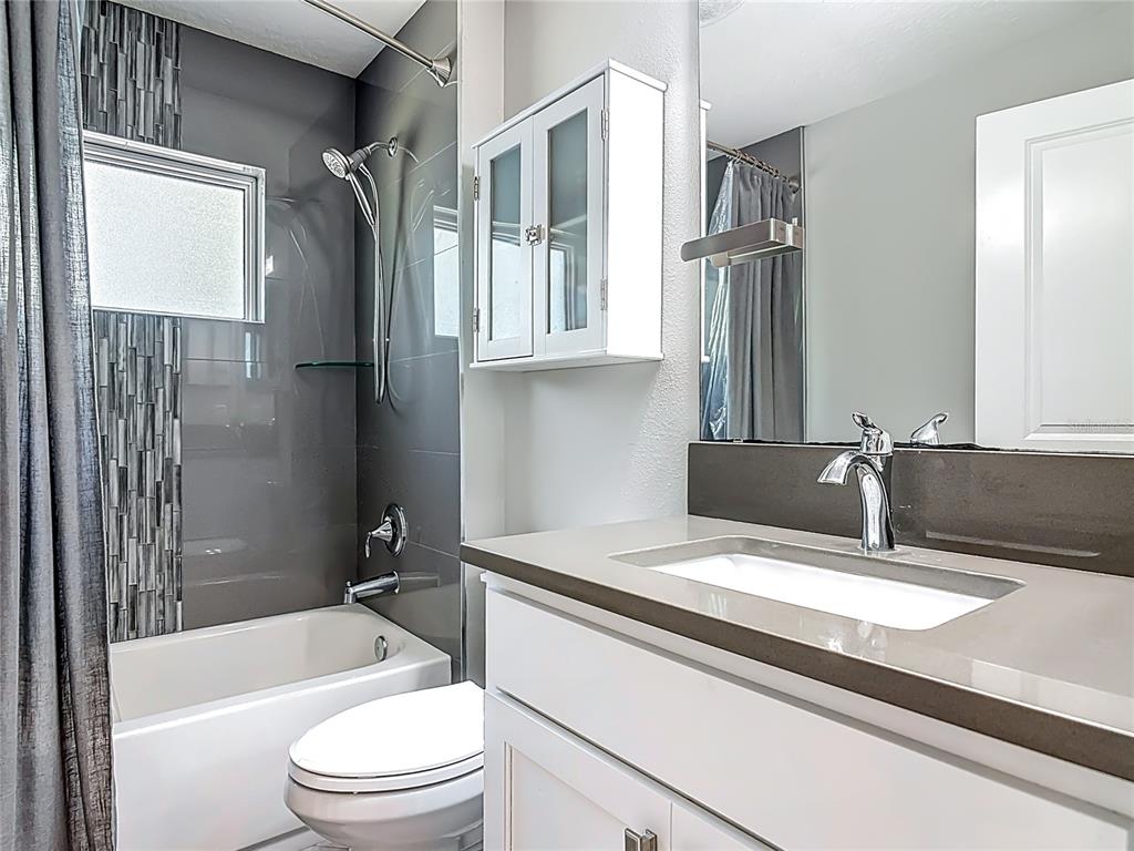 108 Palmira Road DeBary, FL 32713 - Photo 21 of 29 a bathroom with a sink a toilet and a bathtub