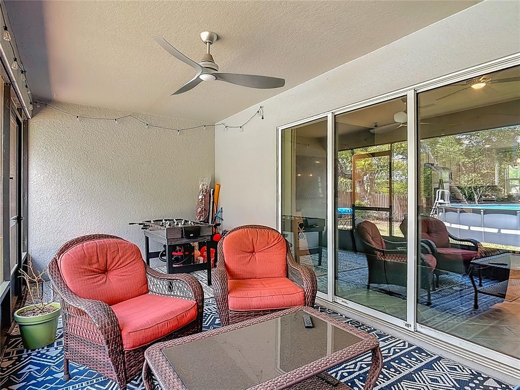 108 Palmira Road DeBary, FL 32713 - Photo 22 of 29 a room with table chair and glass door