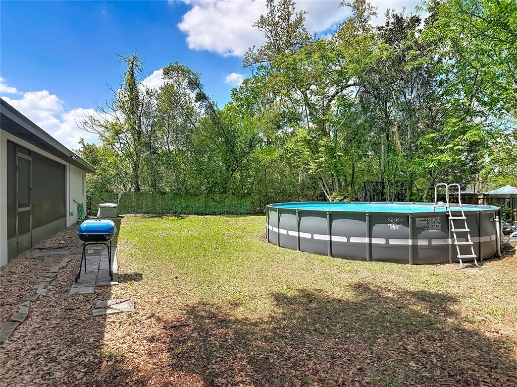 108 Palmira Road DeBary, FL 32713 - Photo 24 of 29 a view of a house with a yard and sitting area