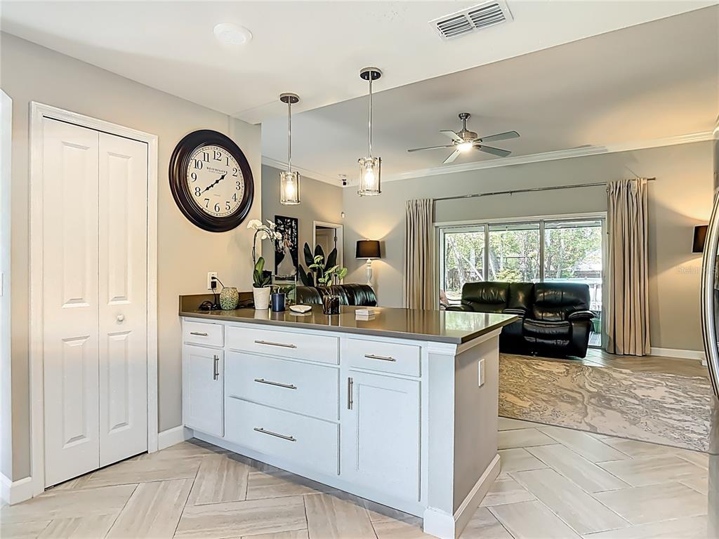 108 Palmira Road DeBary, FL 32713 - Photo 8 of 29 a view of a kitchen with a table and a large mirror