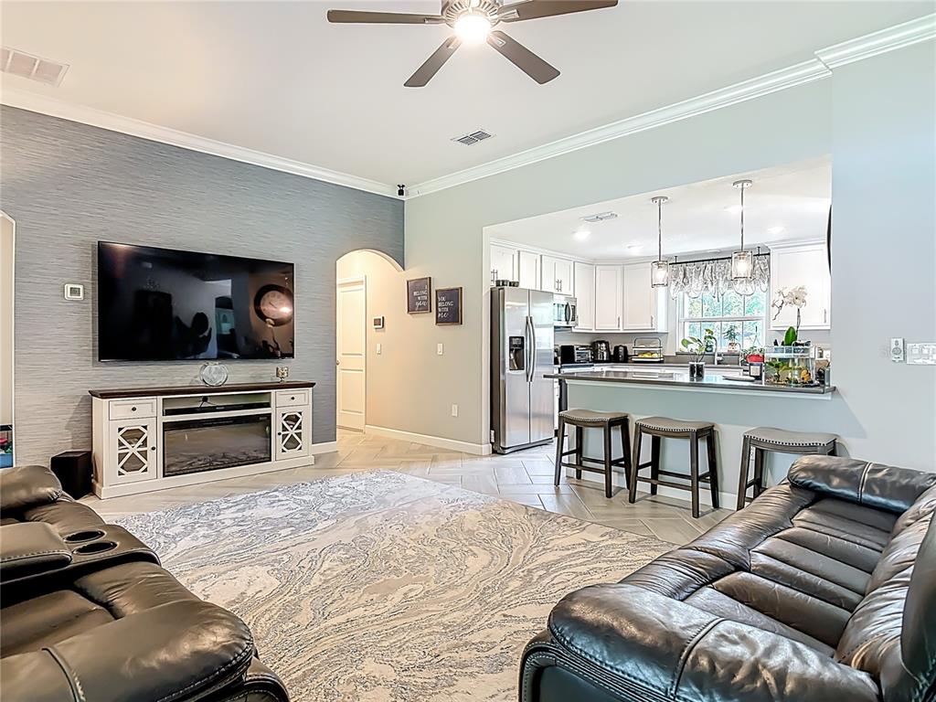 108 Palmira Road DeBary, FL 32713 - Photo 10 of 29 a living room with furniture and a flat screen tv