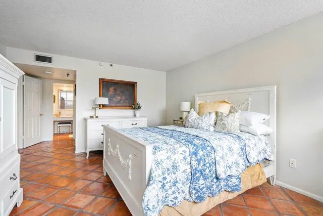 a bed room with a bed and a television