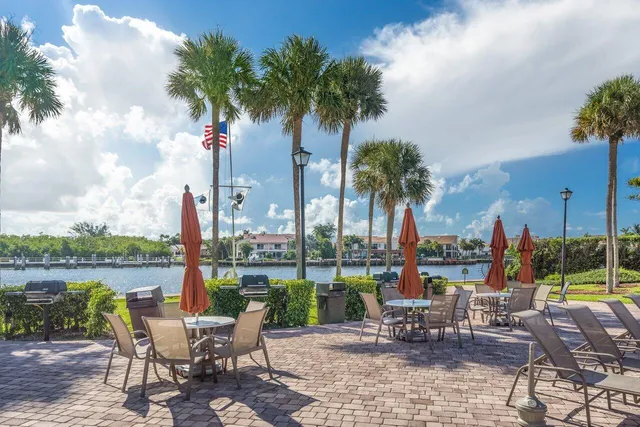 a view of a sitting area with swimming pool and chair