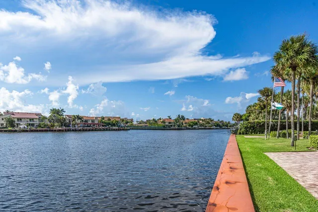 a view of a lake with houses in the back