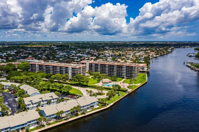 a view of a swimming pool with an outdoor seating
