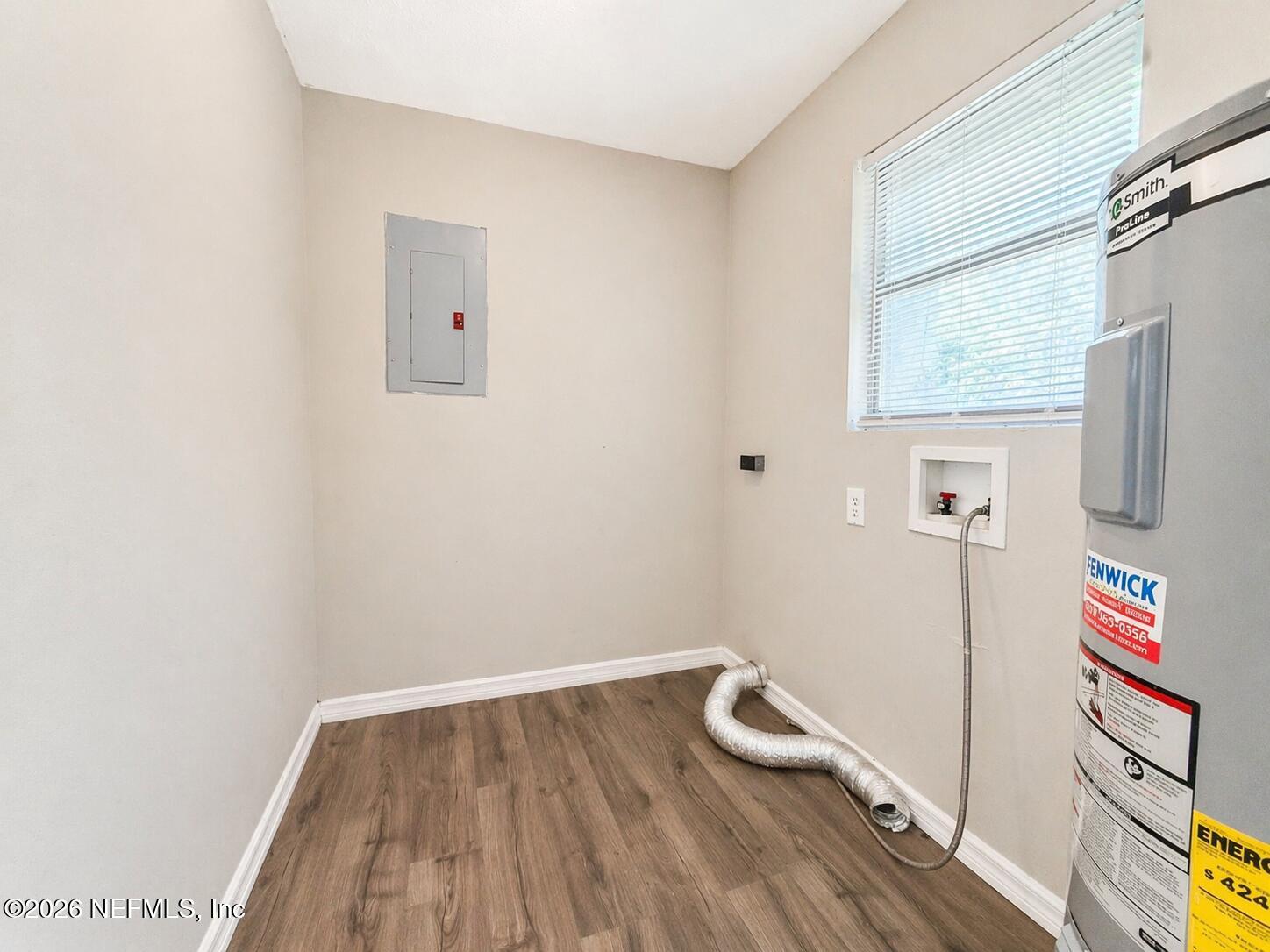 874 West 12th Street St. Augustine, FL 32084 - Photo 14 of 29 a view of a hallway with wooden floor and a bathroom