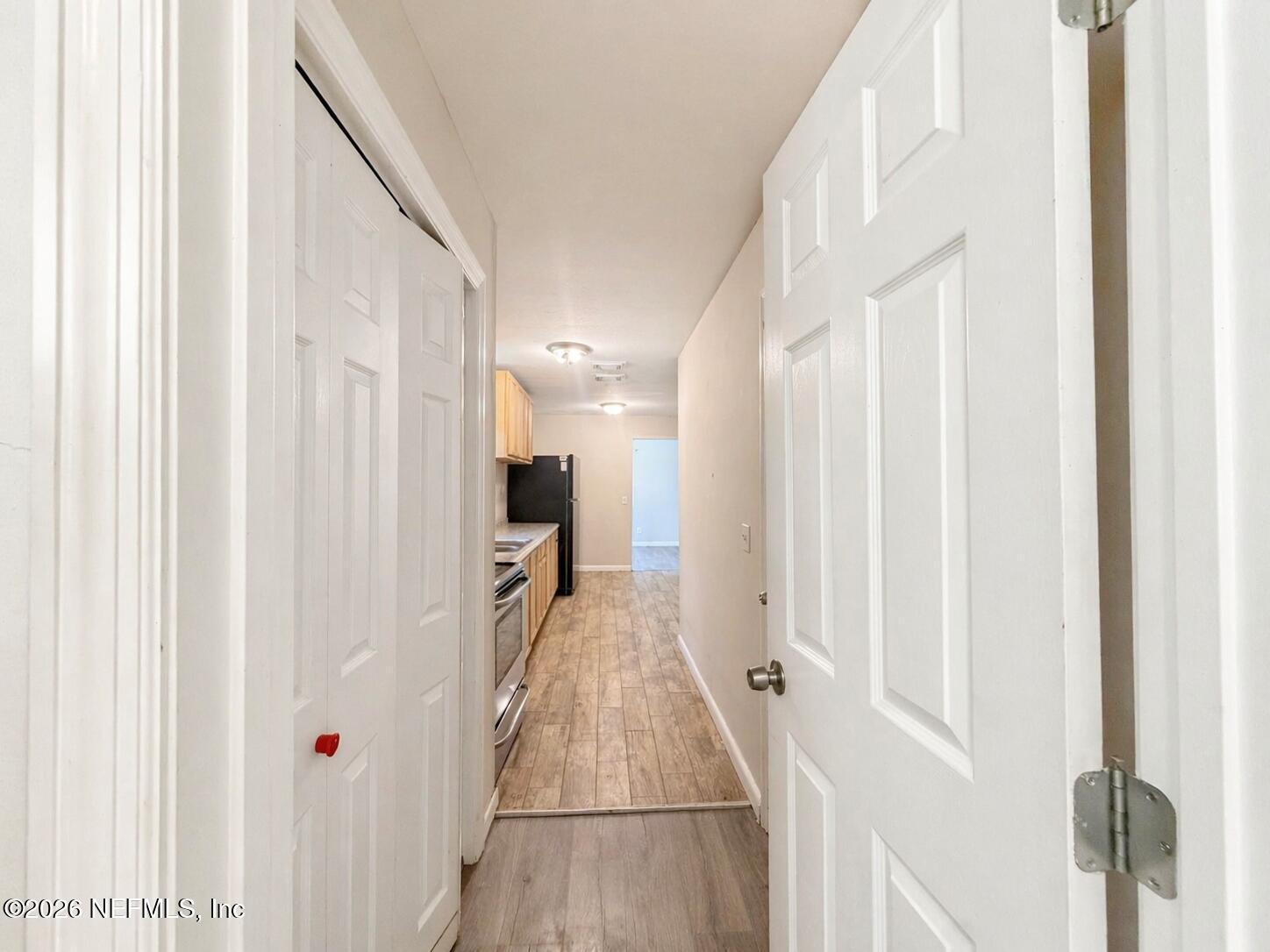 874 West 12th Street St. Augustine, FL 32084 - Photo 18 of 29 a view of a hallway with a white walls and stairs