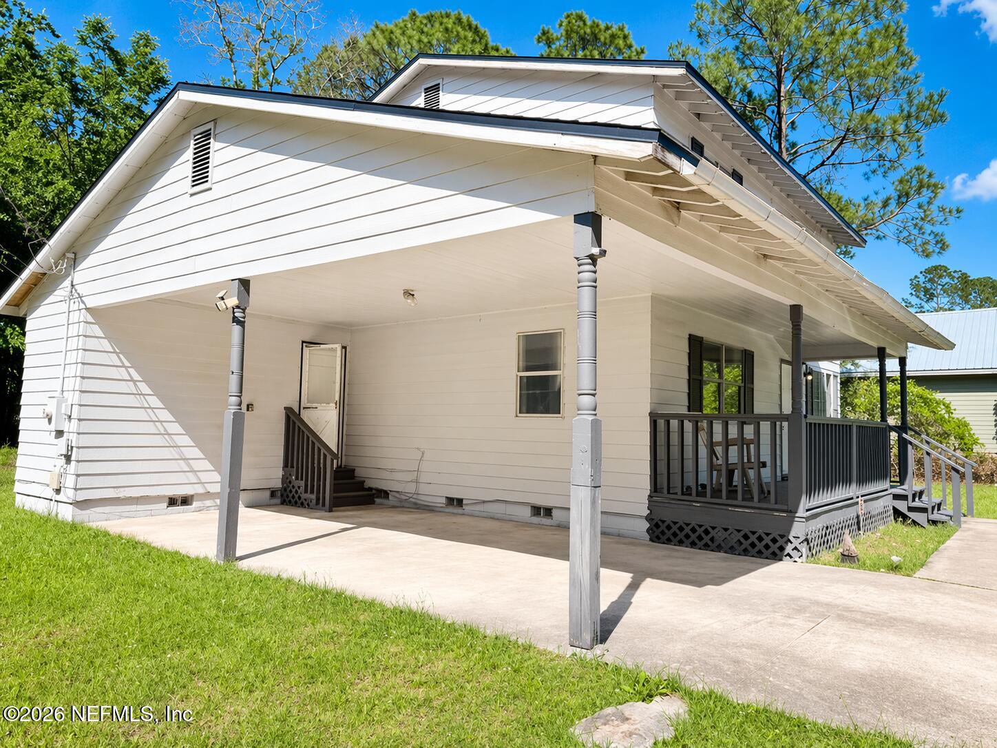 874 West 12th Street St. Augustine, FL 32084 - Photo 2 of 29 a view of a house with a yard