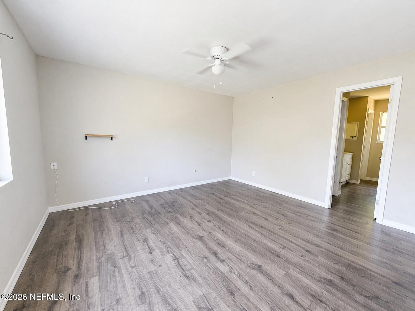 874 West 12th Street St. Augustine, FL 32084 - Photo 23 of 29 wooden floor in an empty room