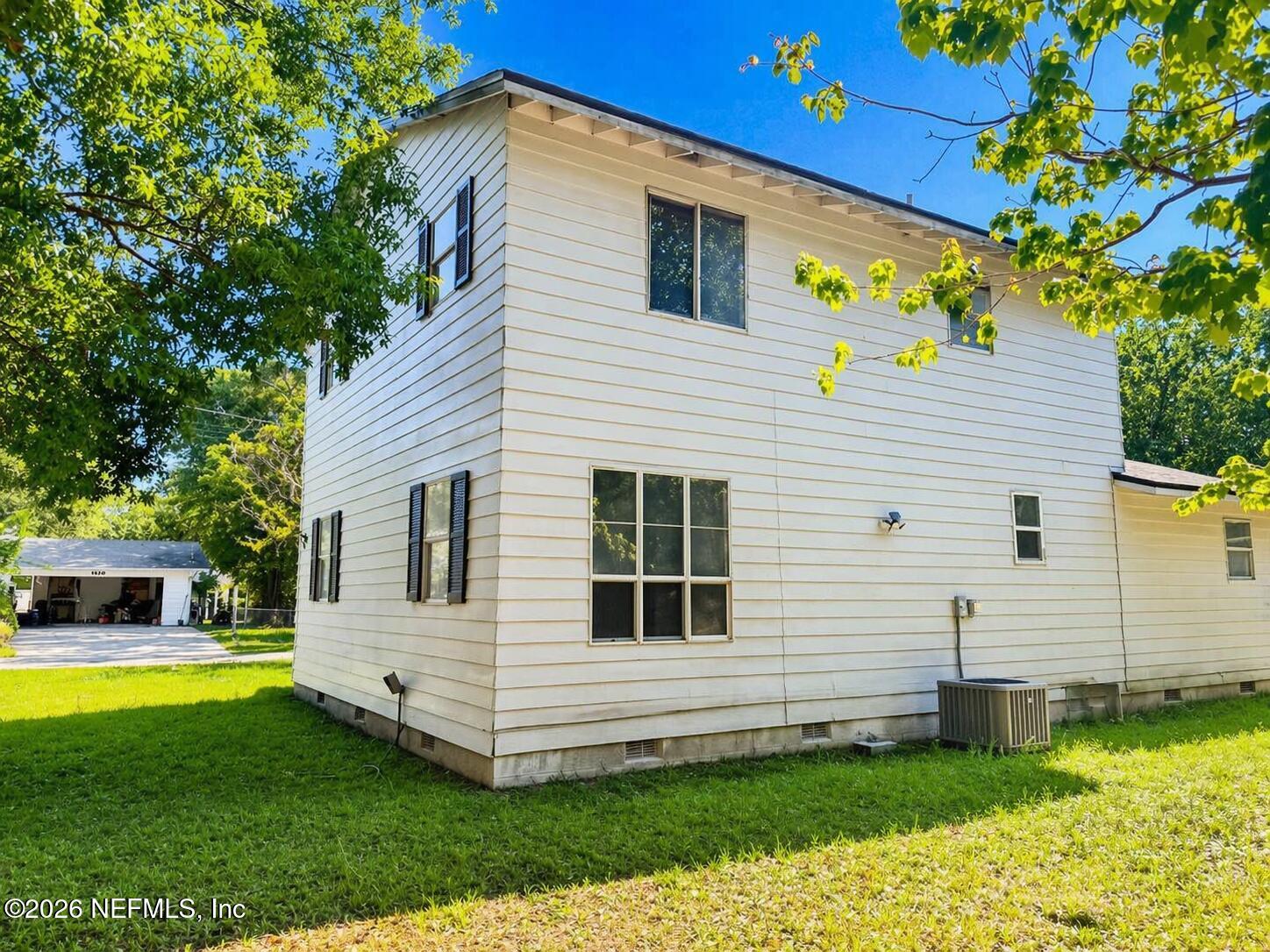 874 West 12th Street St. Augustine, FL 32084 - Photo 4 of 29 a view of a house with a yard