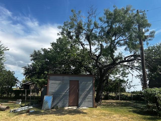 320 County Road 401 Comanche, TX 76442 - Photo 24 of 26 a view of a house with pool and trees in the background