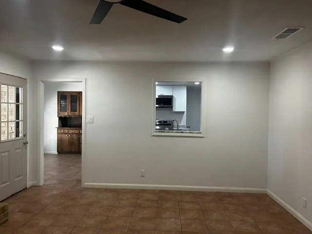 en empty room with closet and windows