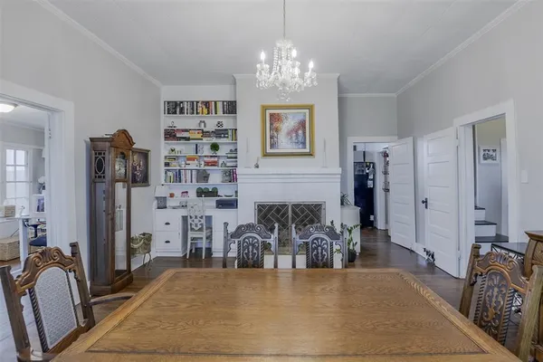 a view of a livingroom with furniture and chandelier