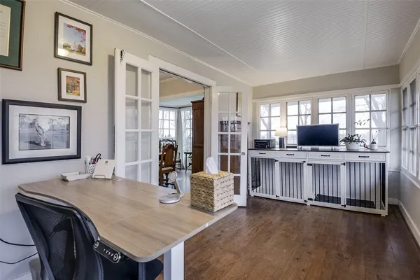 a view of a dining room with furniture and windows