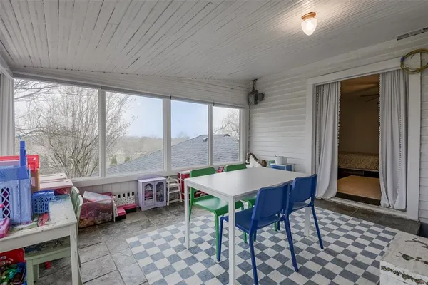 a room with furniture a table and a large window