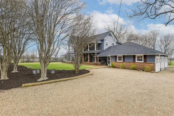 front view of a house with a yard