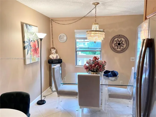 a view of entryway with furniture and front door
