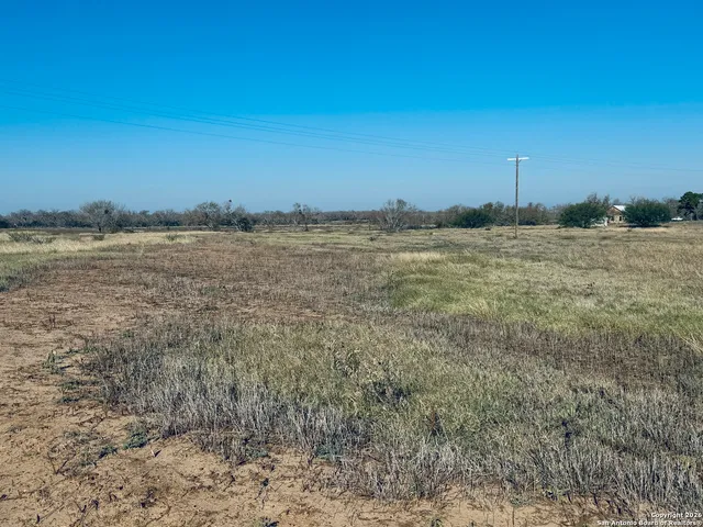 a view of a large building with an ocean