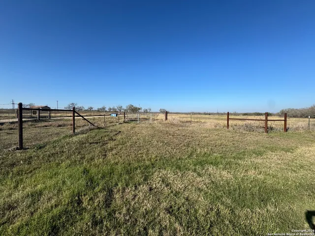 a view of a yard with an ocean view