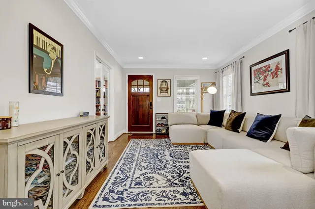 a bedroom with furniture and a rug
