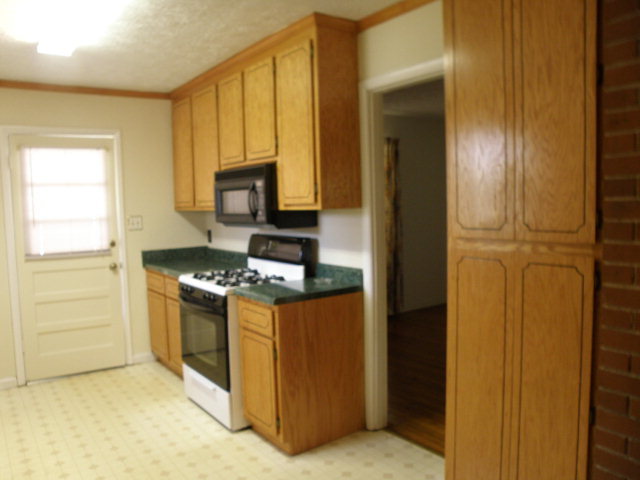 373 Greene Settlement Road Gray, GA 31032 - Photo 24 of 34 a kitchen with stainless steel appliances granite countertop a stove and a refrigerator