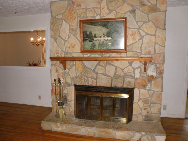 373 Greene Settlement Road Gray, GA 31032 - Photo 25 of 34 a fireplace with a vase on top of it