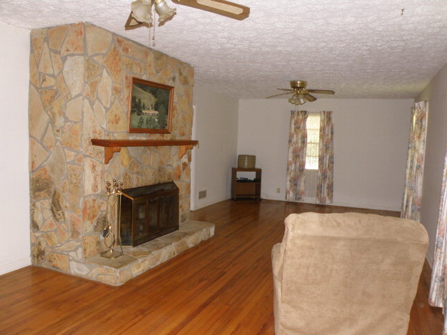 373 Greene Settlement Road Gray, GA 31032 - Photo 26 of 34 a view of a livingroom with a fireplace and window