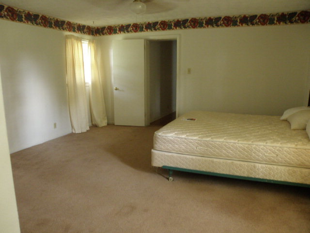 373 Greene Settlement Road Gray, GA 31032 - Photo 32 of 34 a bedroom with a bed and a window