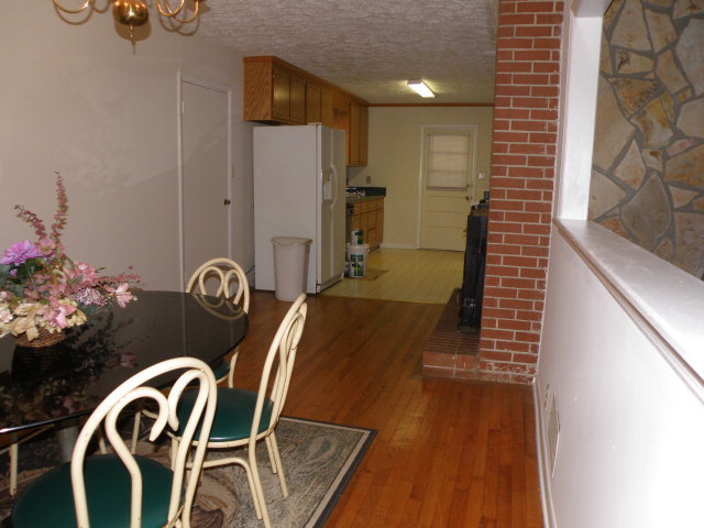 373 Greene Settlement Road Gray, GA 31032 - Photo 33 of 34 a view of a dining room with furniture and wooden floor