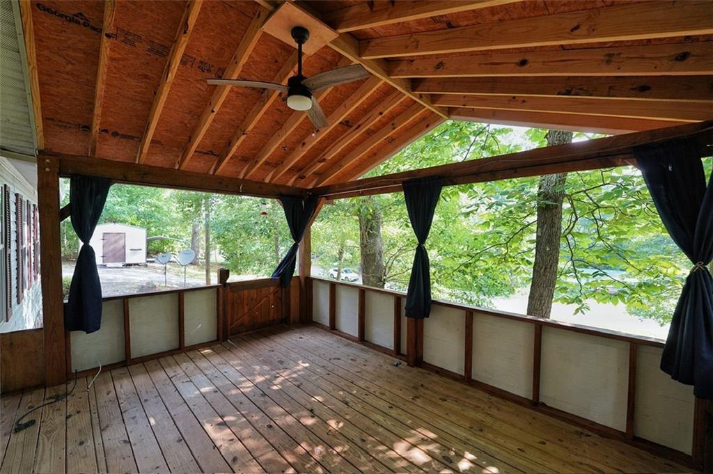a view of room with wooden floor and outdoor space