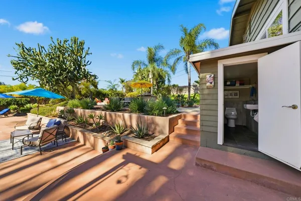 a kitchen with stainless steel appliances a stove a microwave and a sink