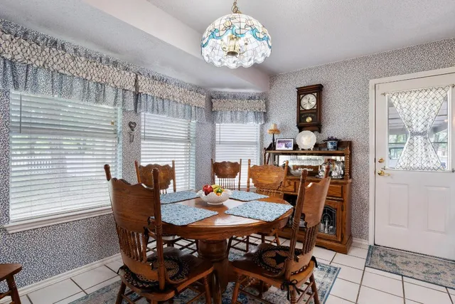 a bathroom with a sink toilet a mirror and shower