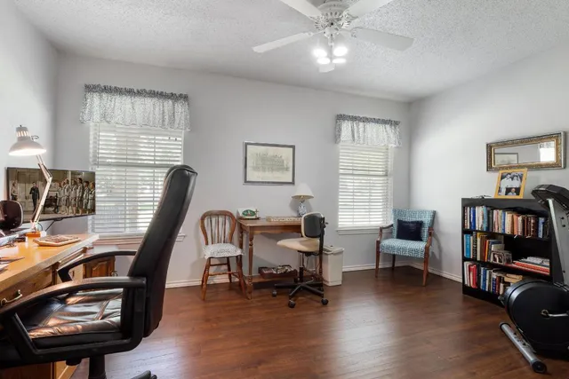 a view of a workspace with furniture and a lounge chair
