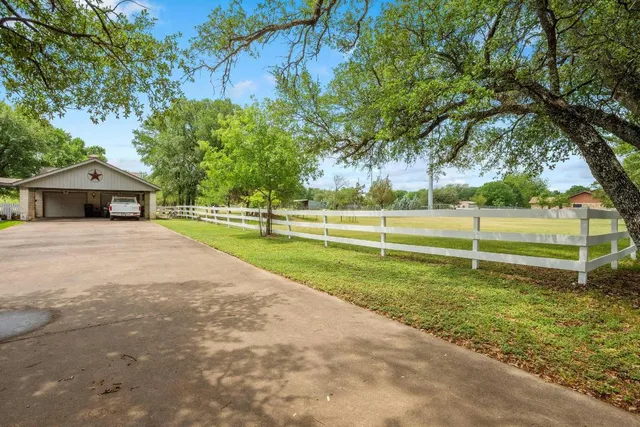 a view of a lake with a yard