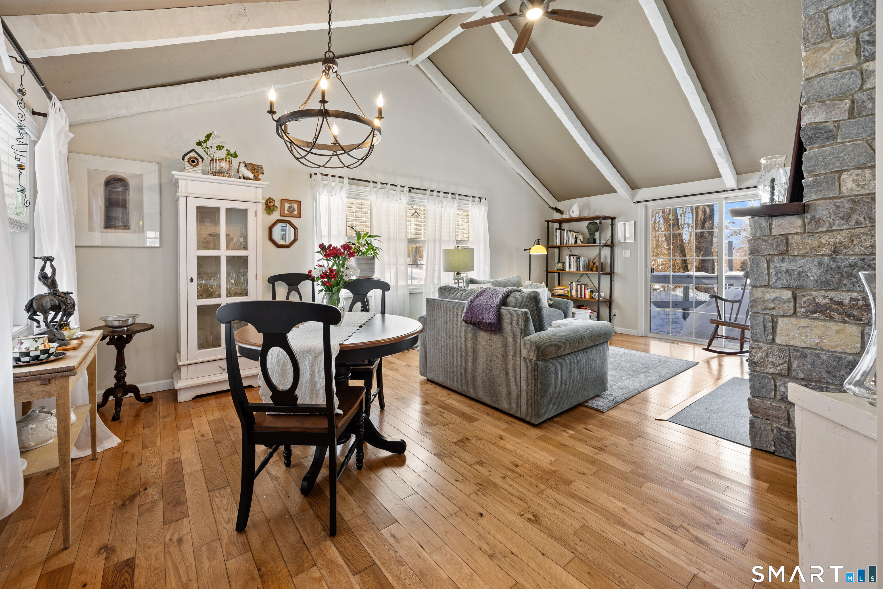 28 Davis Road New Hartford, CT 06057 - Photo 12 of 39 a living room with furniture a dining table and a chandelier