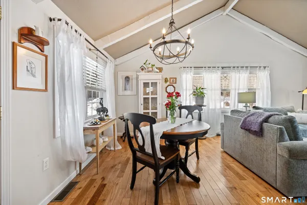 a bedroom with a bed and a table