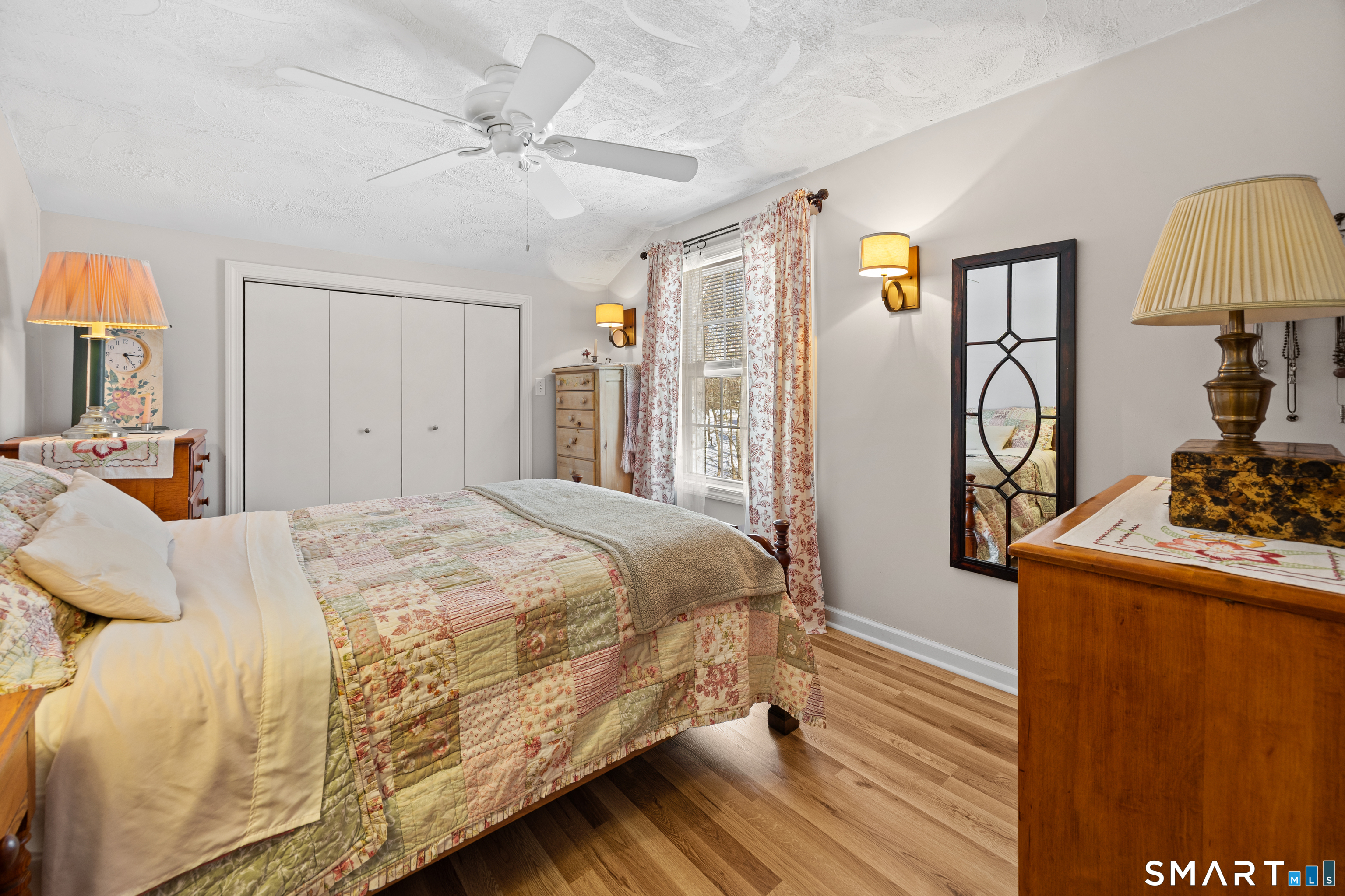 28 Davis Road New Hartford, CT 06057 - Photo 17 of 39 a bedroom with a bed and wooden floor