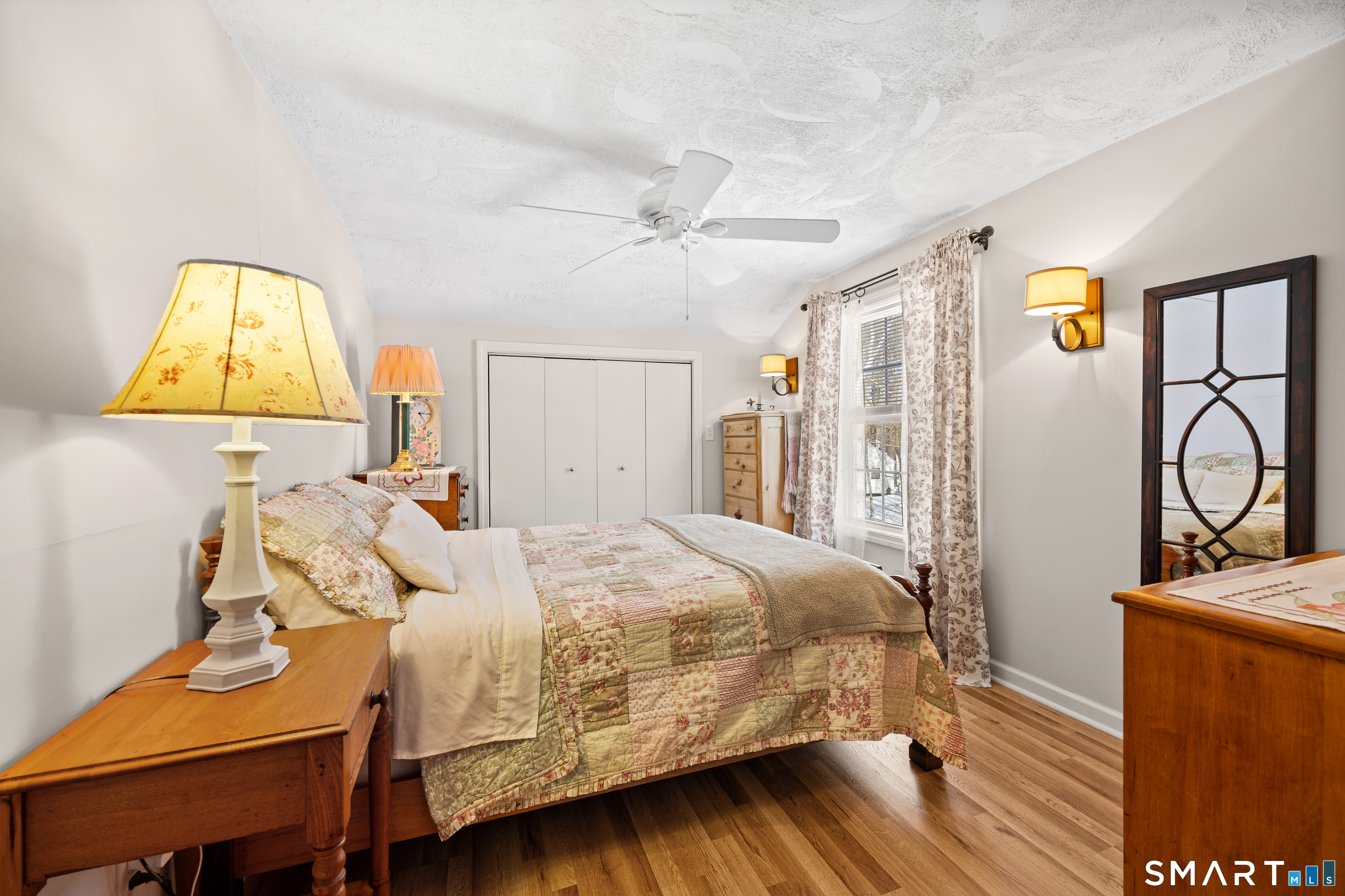 28 Davis Road New Hartford, CT 06057 - Photo 18 of 39 a bedroom with a bed and a table