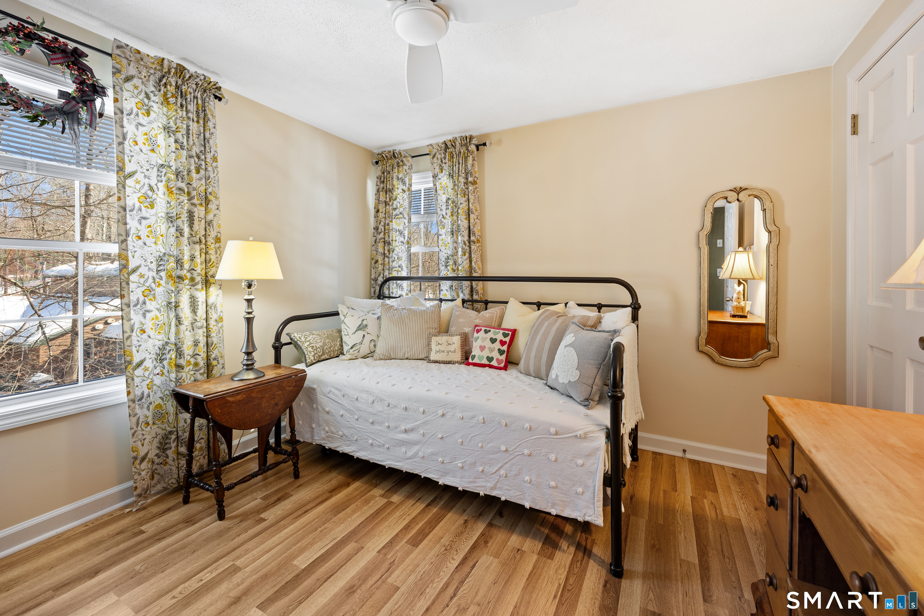 28 Davis Road New Hartford, CT 06057 - Photo 21 of 39 a bedroom with a bed and wooden floor