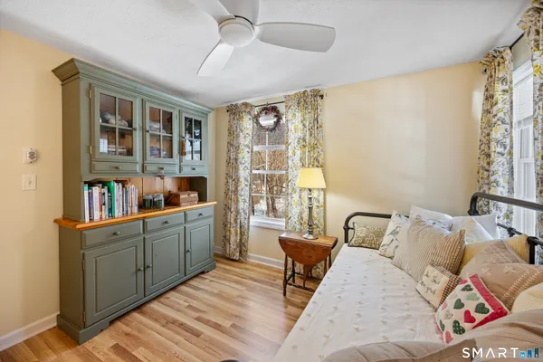 a bed room with a bed and a book shelf