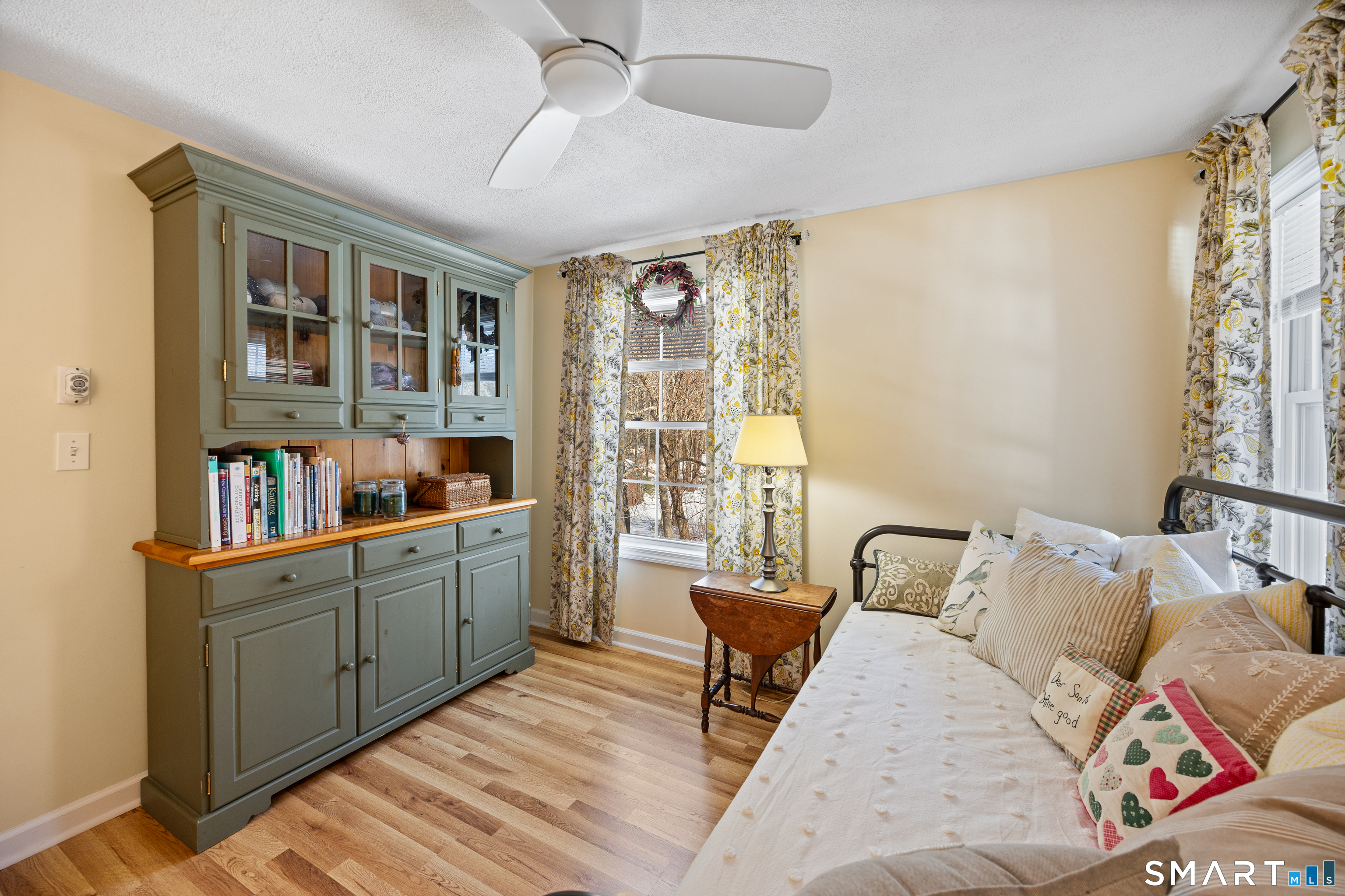 28 Davis Road New Hartford, CT 06057 - Photo 22 of 39 a bed room with a bed and a book shelf