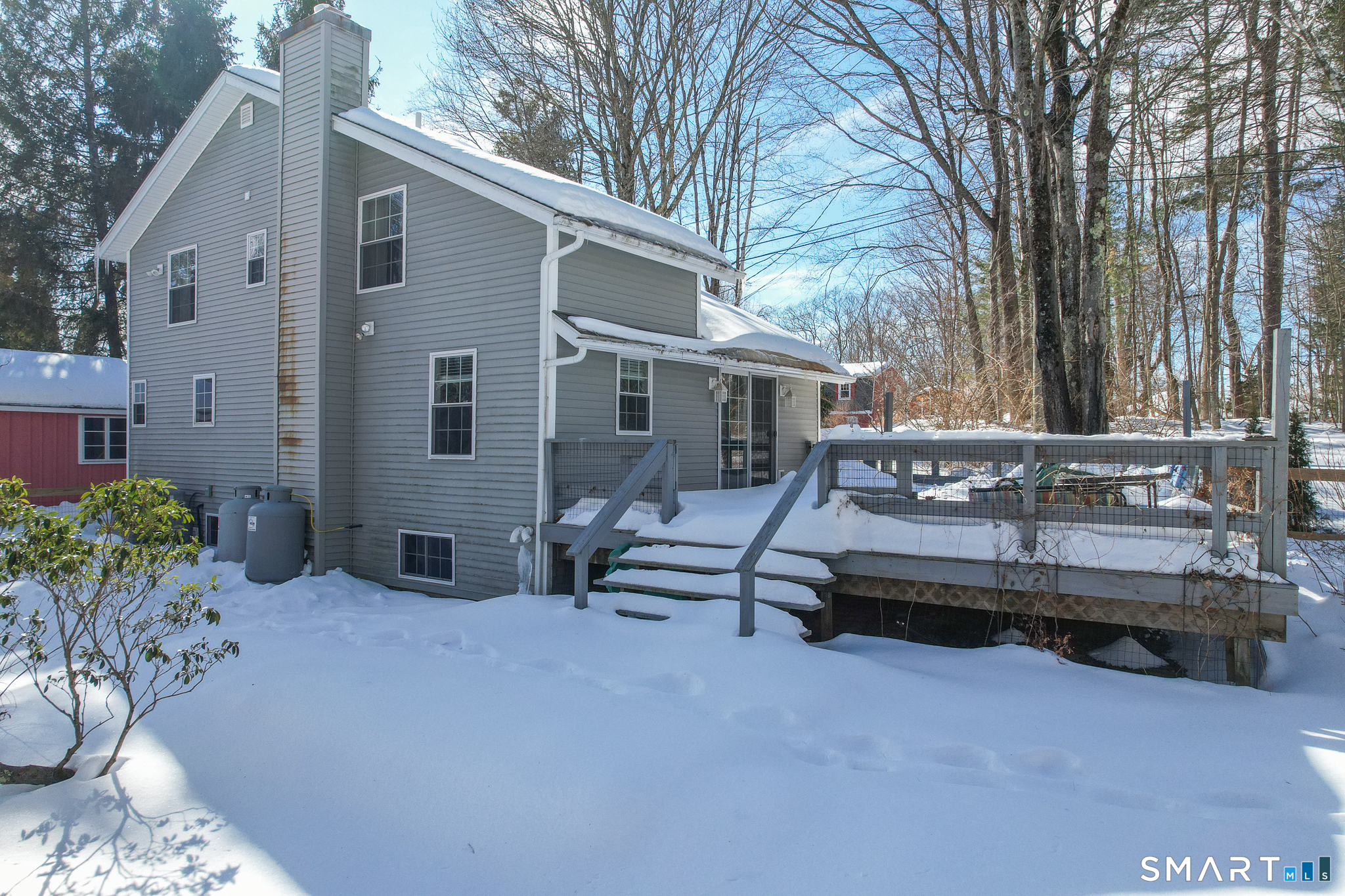 28 Davis Road New Hartford, CT 06057 - Photo 27 of 39 a view of a house with a bed and chairs in patio