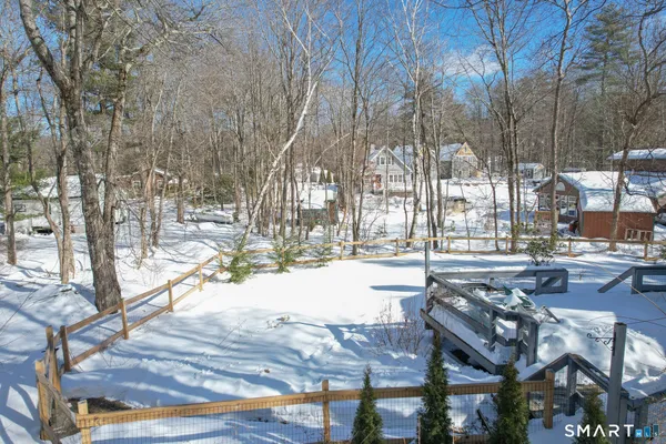 a view of a backyard with sitting area