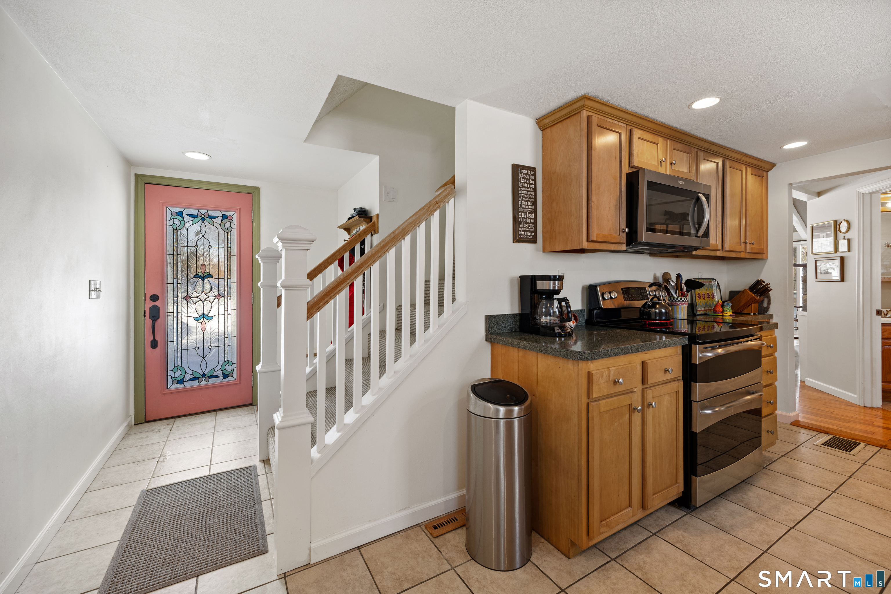 28 Davis Road New Hartford, CT 06057 - Photo 3 of 39 a kitchen with granite countertop a refrigerator a stove top oven and a sink